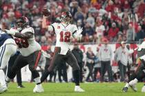 Tampa Bay Buccaneers quarterback Tom Brady (12) makes a pass attempt during an NFL wild-card fo ...