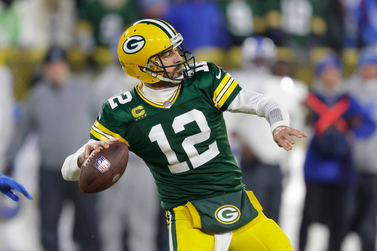 Green Bay Packers quarterback Aaron Rodgers (12) passes during an NFL football game against the ...