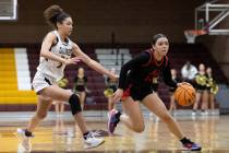 Coronado’s Kaylee Walters (14) dribbles around Faith Lutheran’s Leah Mitchell, le ...