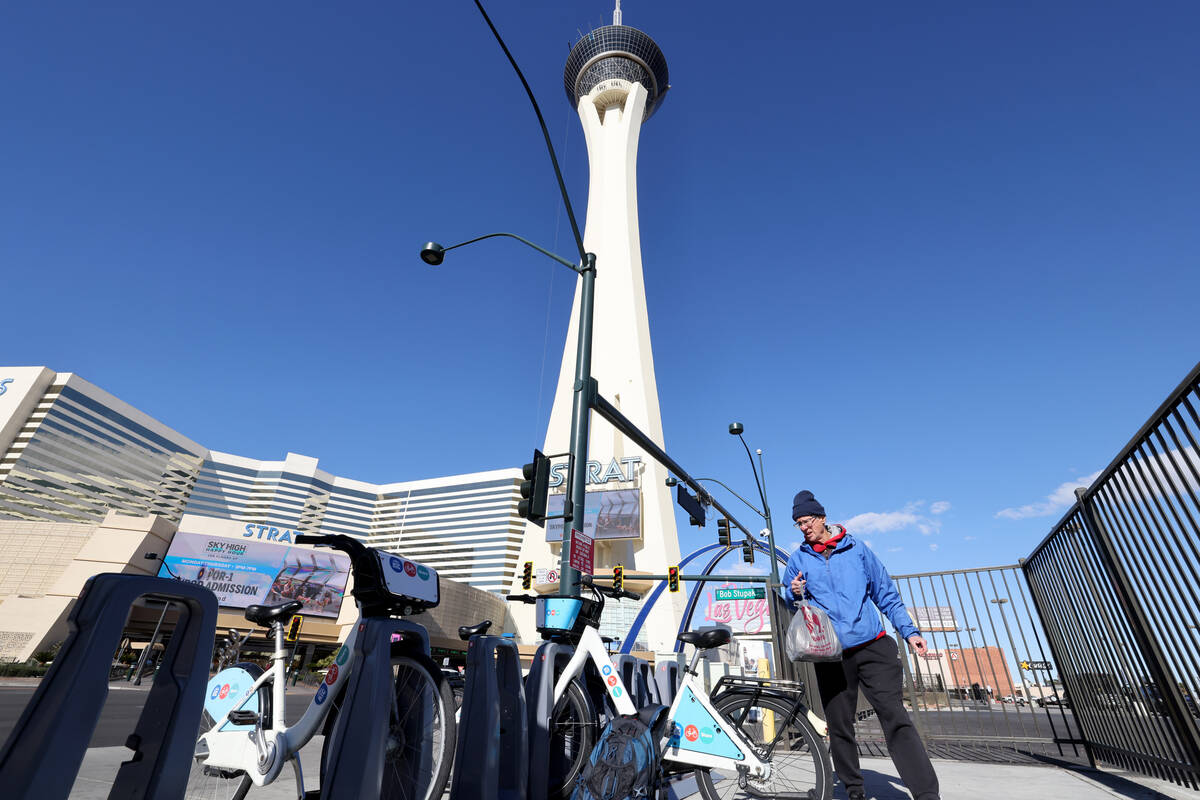 Richard Birmingham arrives at The Strat during his daily bicycle outreach ride in downtown Las ...