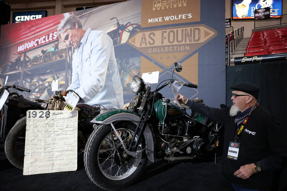 Larry Holt of Whittier. Calif. checks out a 1936 Harley-Davidson EL Knucklehead in the “ ...