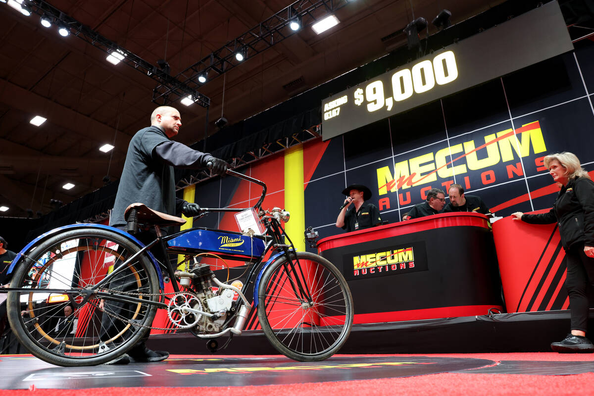 A pusher shows a 1916 Miami Single on the auction block at the Mecum Las Vegas Vintage and Anti ...