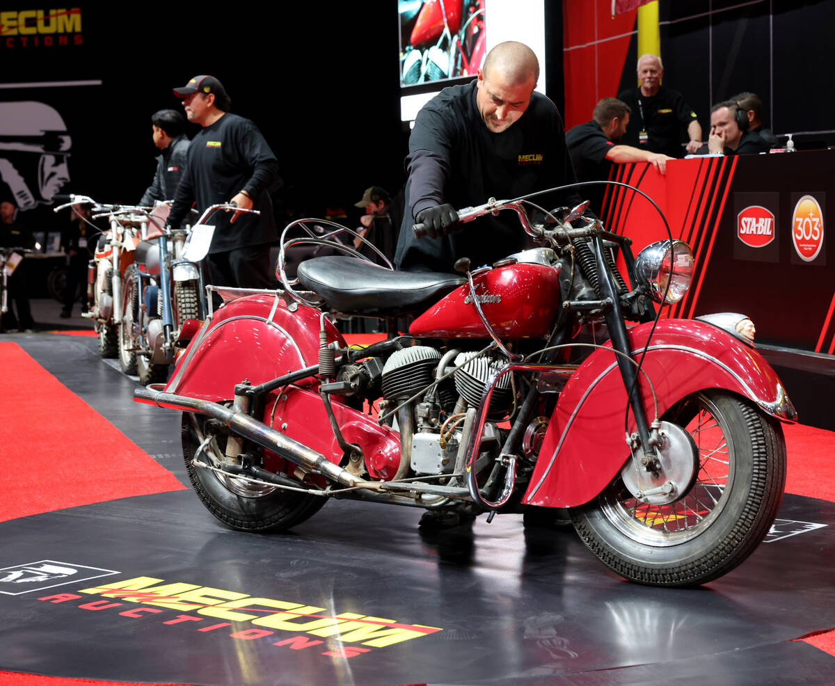 A pusher shows a 1948 Indian Chief on the auction block at the Mecum Las Vegas Vintage and Anti ...