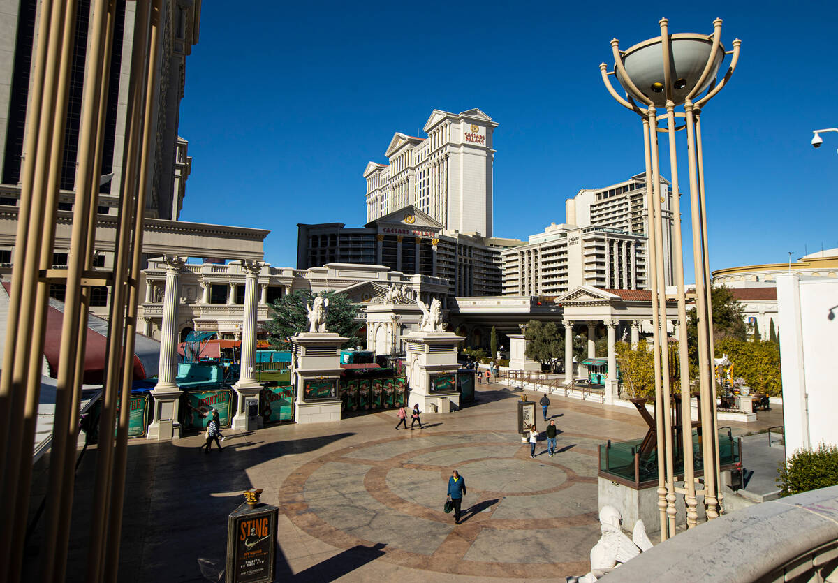People walk outside of Caesars Palace on Thursday, Jan. 26, 2023, in Las Vegas. (Chase Stevens/ ...