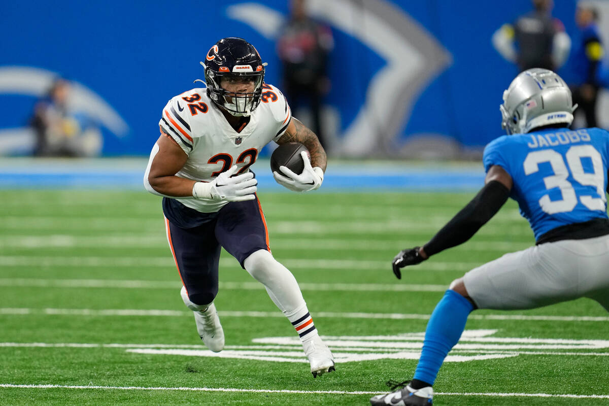 Chicago Bears running back David Montgomery rushes during the first half of an NFL football gam ...