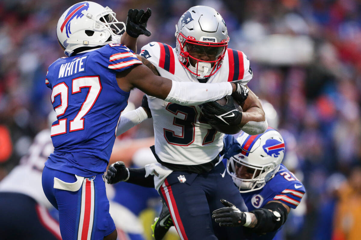Buffalo Bills cornerback Tre'Davious White (27) and safety Jordan Poyer (21) tackle New England ...