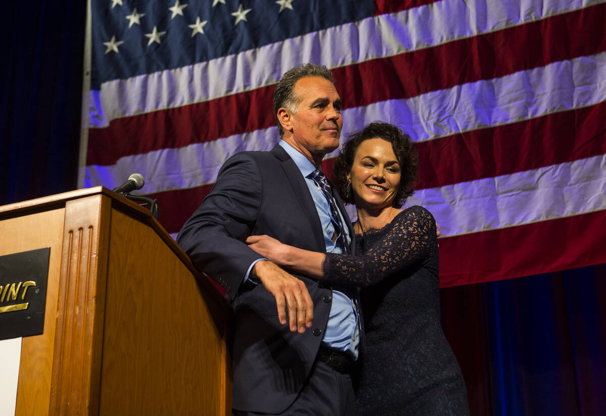 Amy Tarkanian comforts her husband Danny Tarkanian, Republican candidate for the 3rd Congressio ...