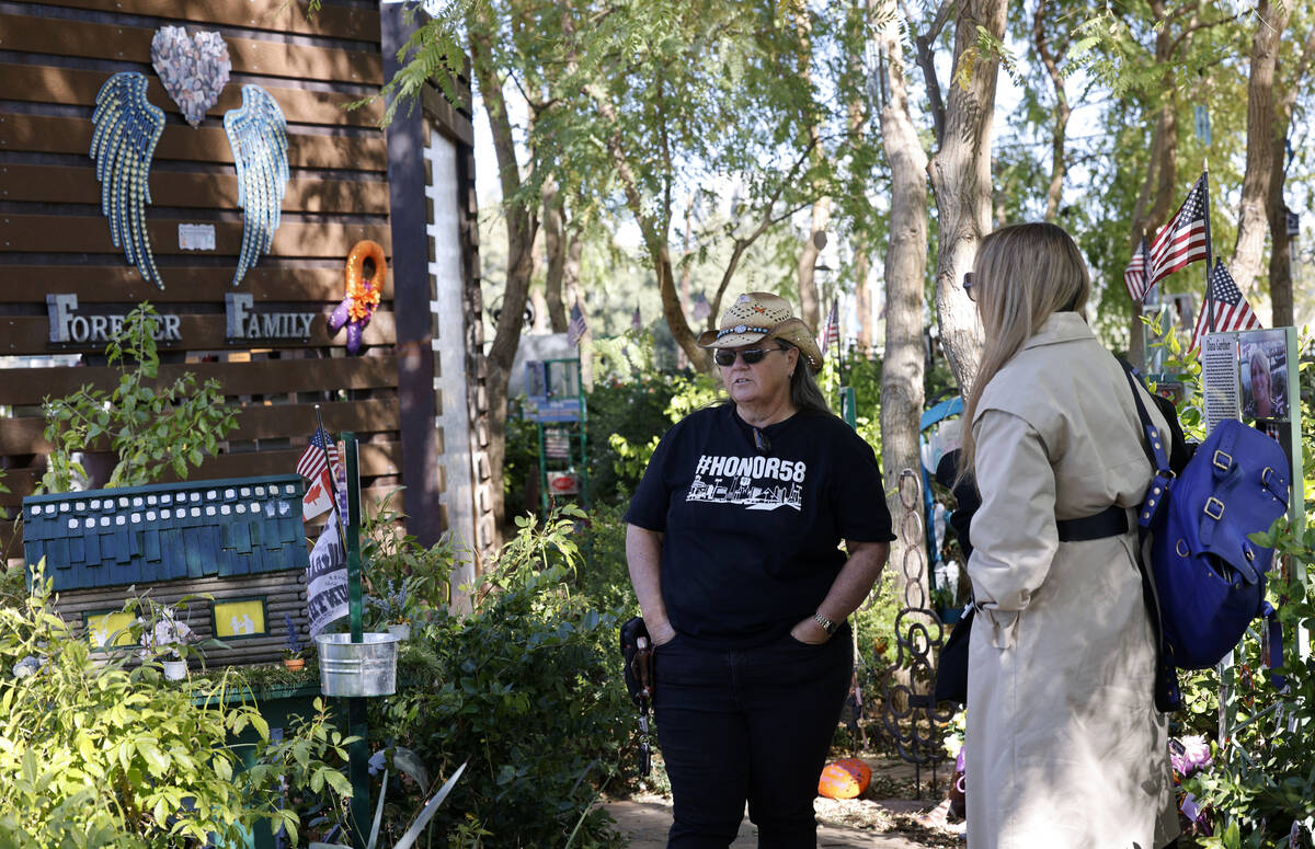 Sue Ann Cornwell of Las Vegas, Route 91 Harvest festival shooting survivor, left, talks with SW ...