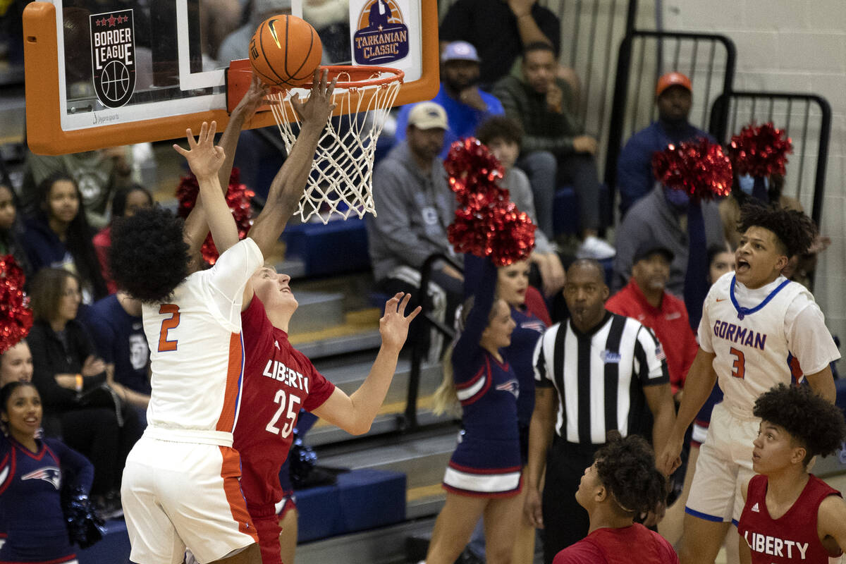 Bishop Gorman’s Keenan Bey (2) shoots against Liberty’s Tyler Bright (25) during ...