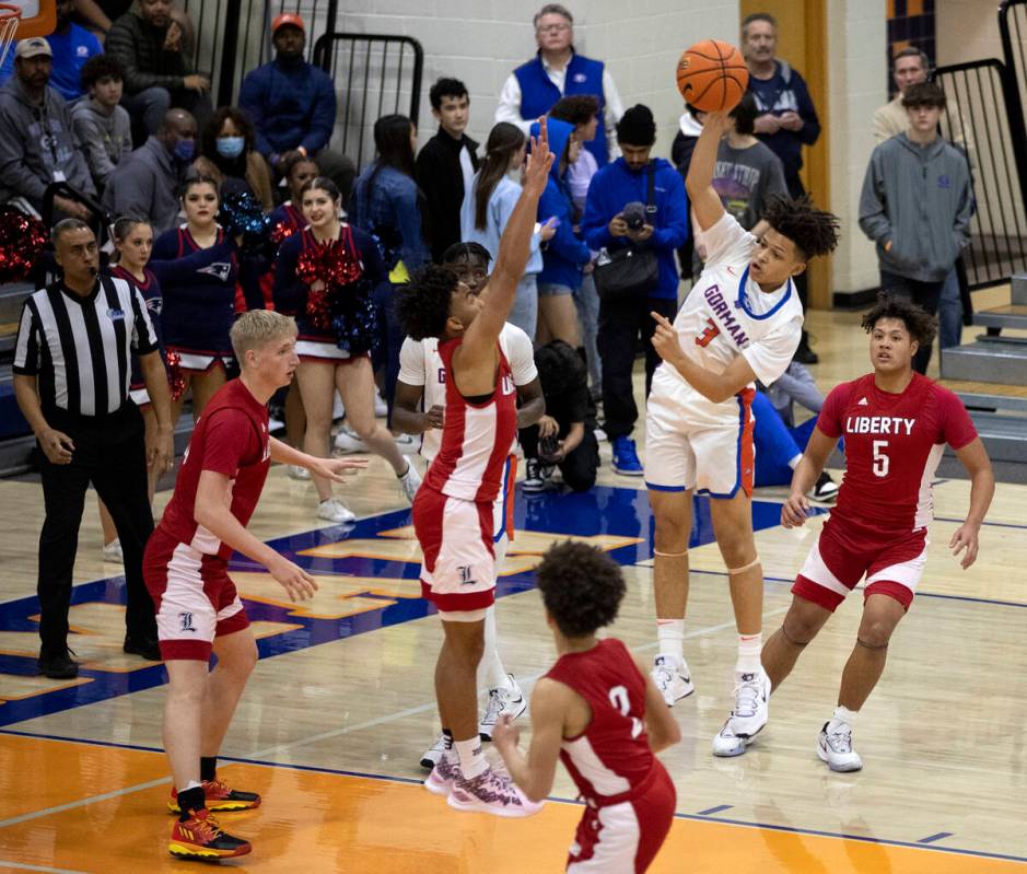 Bishop Gorman’s John Mobley Jr. (3) jumps to pass while Liberty’s Dedan Thomas Jr ...