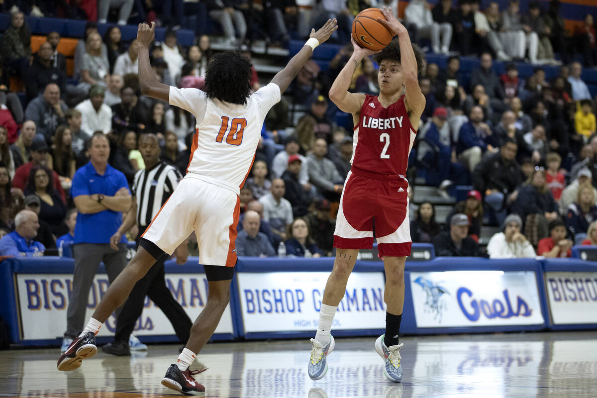 Liberty’s Angelo Kambala (2) shoots against Bishop Gorman’s Nick Jefferson (10) d ...