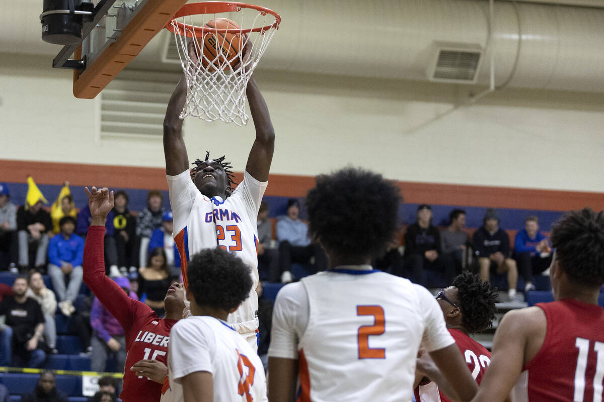 Bishop Gorman’s Chris Nwuli (23) unsuccessfully attempts to dunk against Liberty’ ...