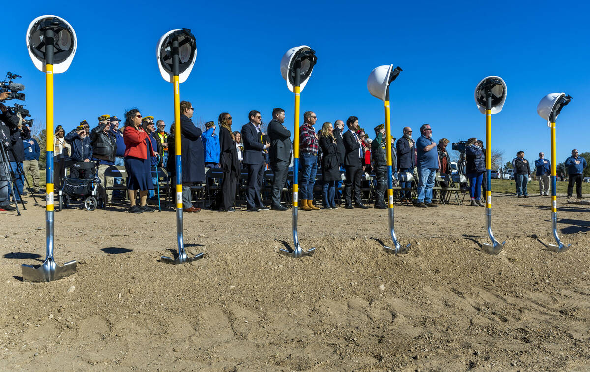 Attendees stand for the Pledge of Allegiance during a groundbreaking ceremony at the Southern N ...
