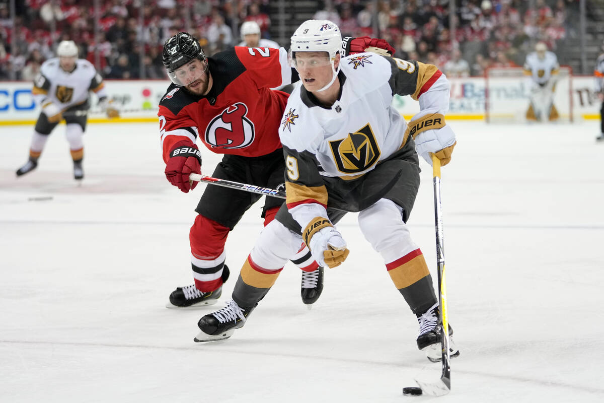 Vegas Golden Knights center Jack Eichel (9) skates against New Jersey Devils defenseman Brendan ...