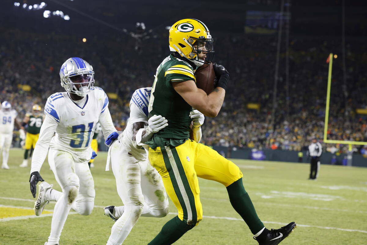 Green Bay Packers wide receiver Allen Lazard (13) catches a touchdown pass during an NFL footba ...