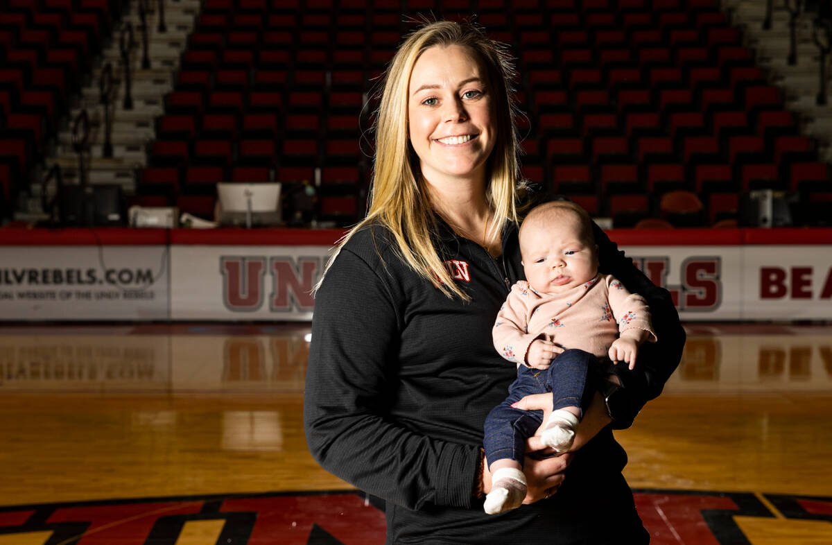 UNLV Lady Rebels head coach Lindy La Rocque poses for a portrait with her newborn baby, Ellie C ...