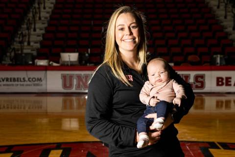 UNLV Lady Rebels head coach Lindy La Rocque poses for a portrait with her newborn baby, Ellie C ...