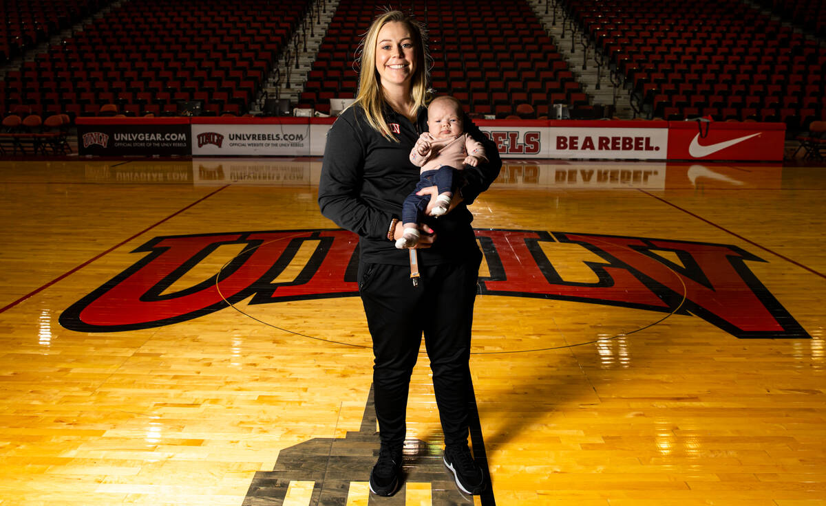 UNLV Lady Rebels head coach Lindy La Rocque poses for a portrait with her newborn baby, Ellie C ...