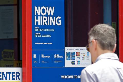 In this Monday, May 22, 2017, photo, a "Now Hiring" sign welcomes a customer entering ...