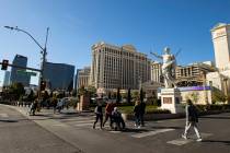 Pedestrians walk along the Las Vegas Strip outside of Caesars Palace on Thursday, Jan. 26, 2023 ...