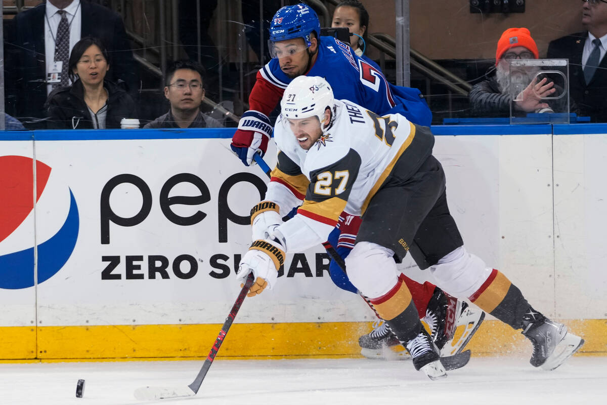 Vegas Golden Knights defenseman Shea Theodore (27) skates against New York Rangers defenseman K ...