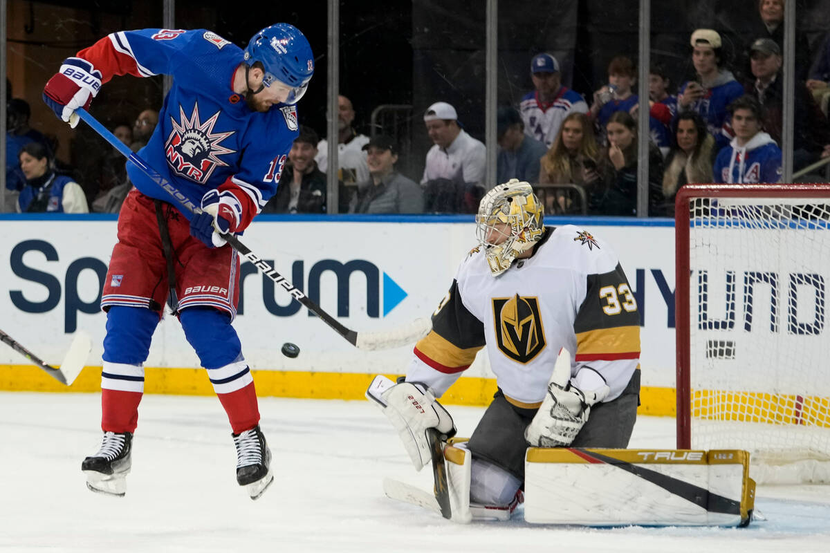 Vegas Golden Knights goaltender Adin Hill (33) makes a save against New York Rangers left wing ...