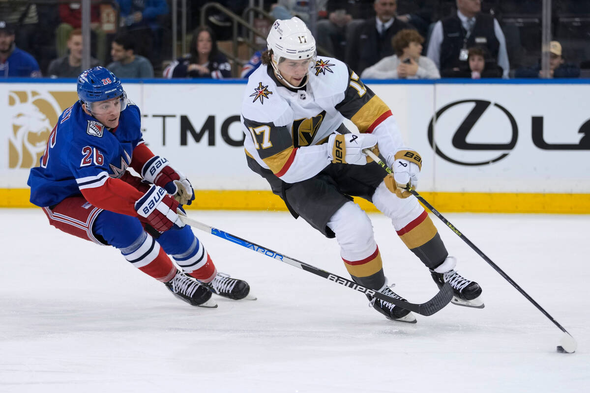 Vegas Golden Knights defenseman Ben Hutton (17) skates with the puck against New York Rangers l ...