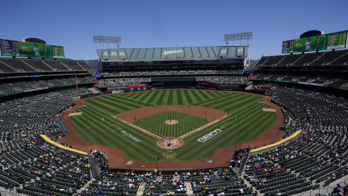 Fans at RingCentral Coliseum watch a baseball game between the Oakland Athletics and the Housto ...
