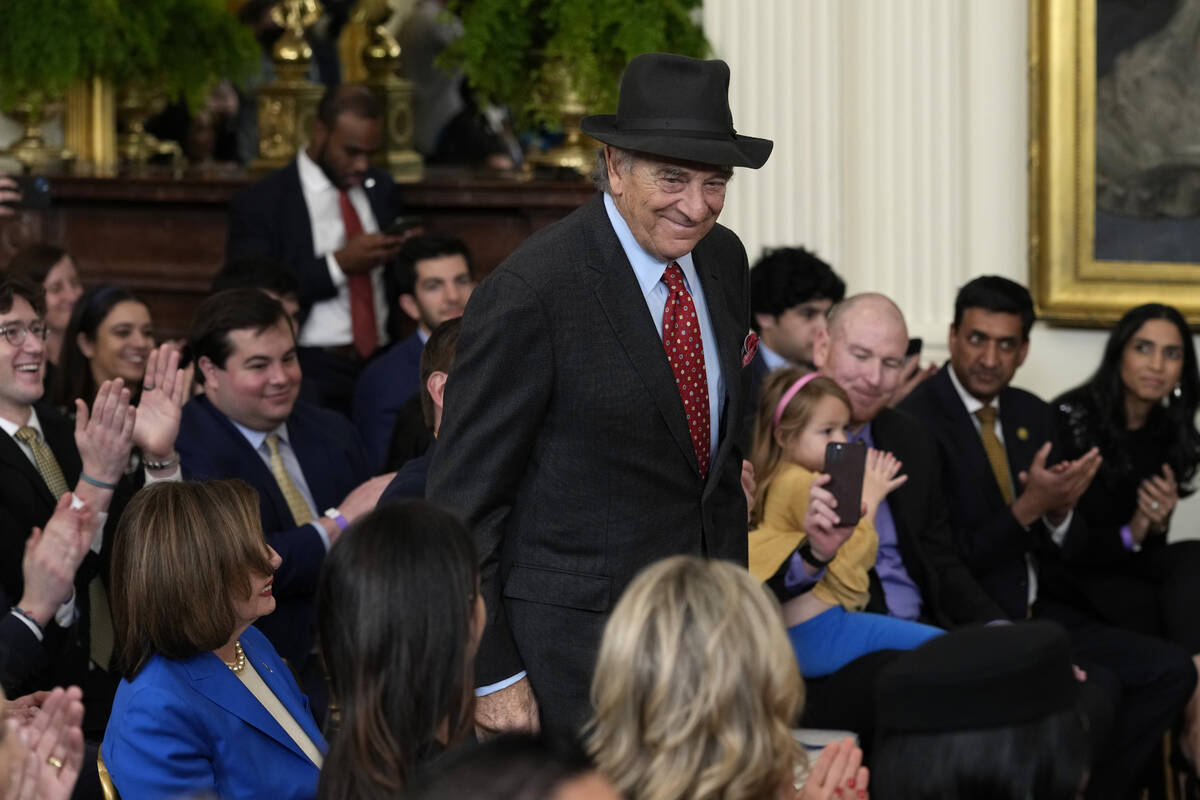 FILE - Paul Pelosi, husband of Rep. Nancy Pelosi, D-Calif., stands up to be recognized before P ...