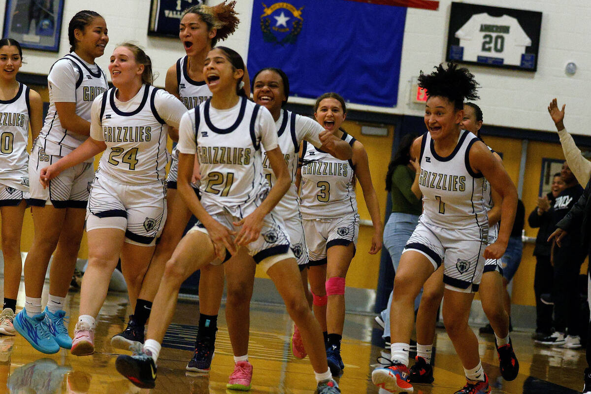 Spring Valley High School players including Spring Valley's Charolette Delisle (21) celebrate t ...