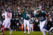 Philadelphia Eagles quarterback Jalen Hurts in action before an NFL divisional round playoff fo ...