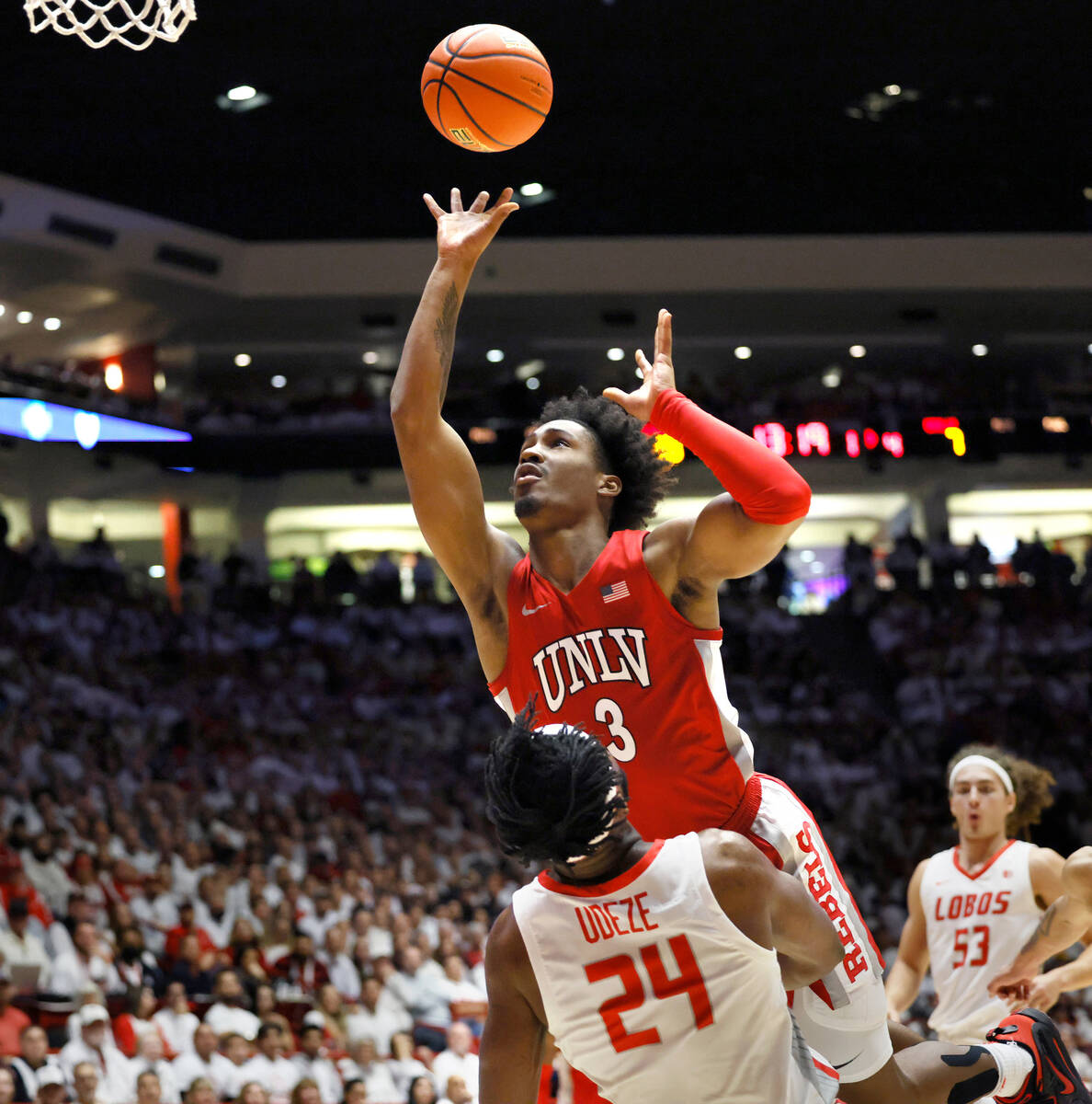 UNLV guard Shane Nowell tries to score over New Mexico's Morris Udeze in the first half of an N ...