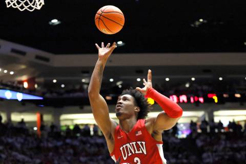 UNLV guard Shane Nowell tries to score over New Mexico's Morris Udeze in the first half of an N ...