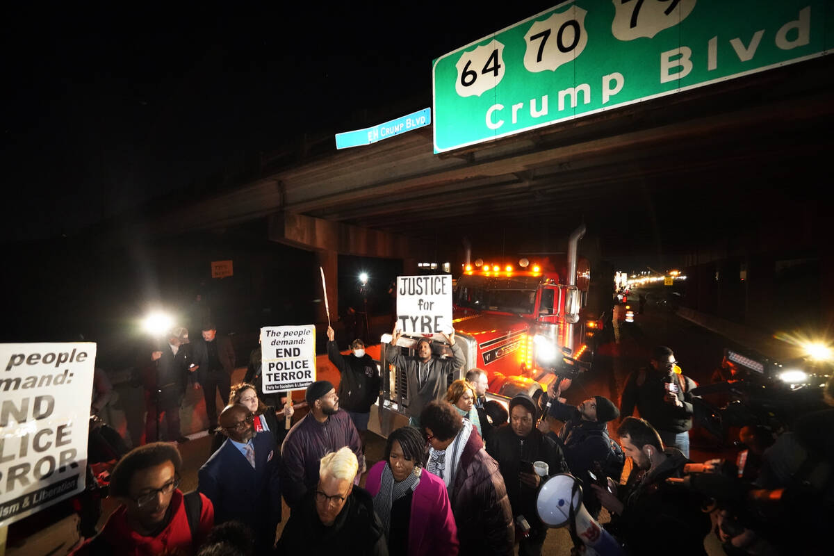 Protesters march down the street Friday, Jan. 27, 2023, in Memphis, Tenn., as authorities relea ...