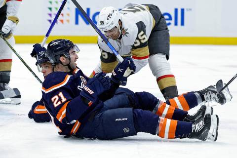 New York Islanders center Kyle Palmieri (21) reacts after Anders Lee, behind, scored a goal aga ...