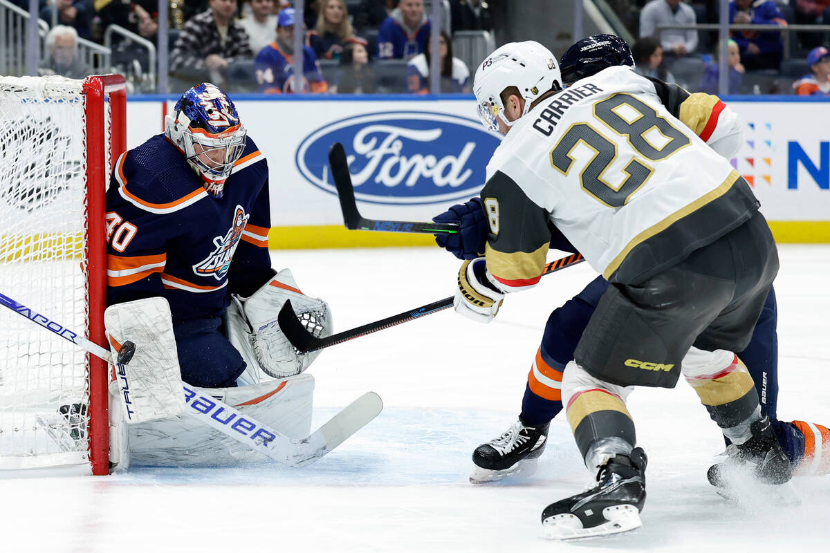 New York Islanders goaltender Semyon Varlamov stops a shot by Vegas Golden Knights left wing Wi ...
