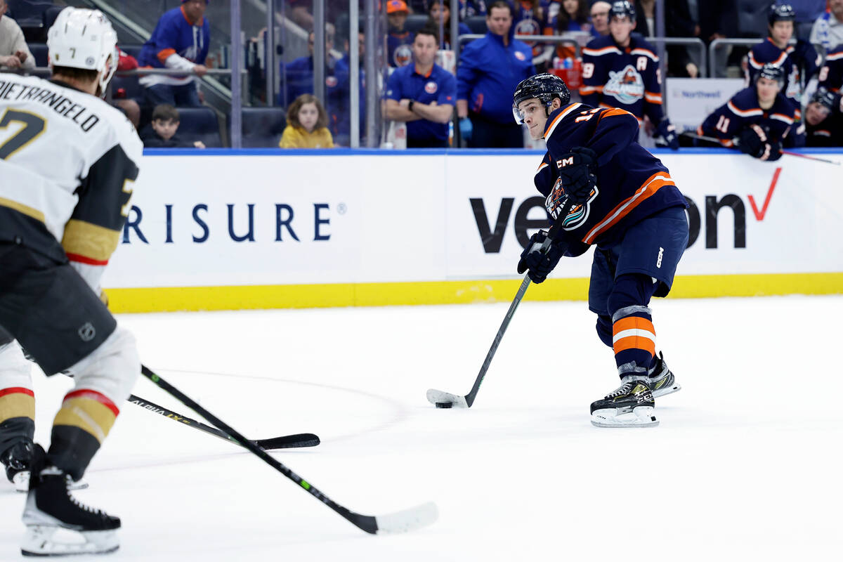 New York Islanders center Mathew Barzal (13) shoots and scores the game winning goal in overtim ...