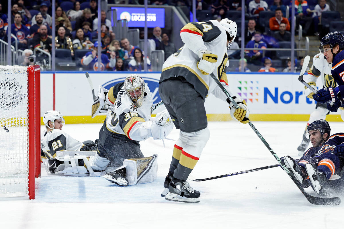 New York Islanders left wing Anders Lee, top right, scores a goal past Vegas Golden Knights goa ...