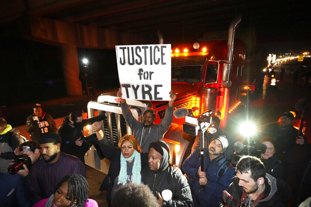 Protesters march down the street Friday, Jan. 27, 2023, in Memphis, Tenn., as authorities relea ...