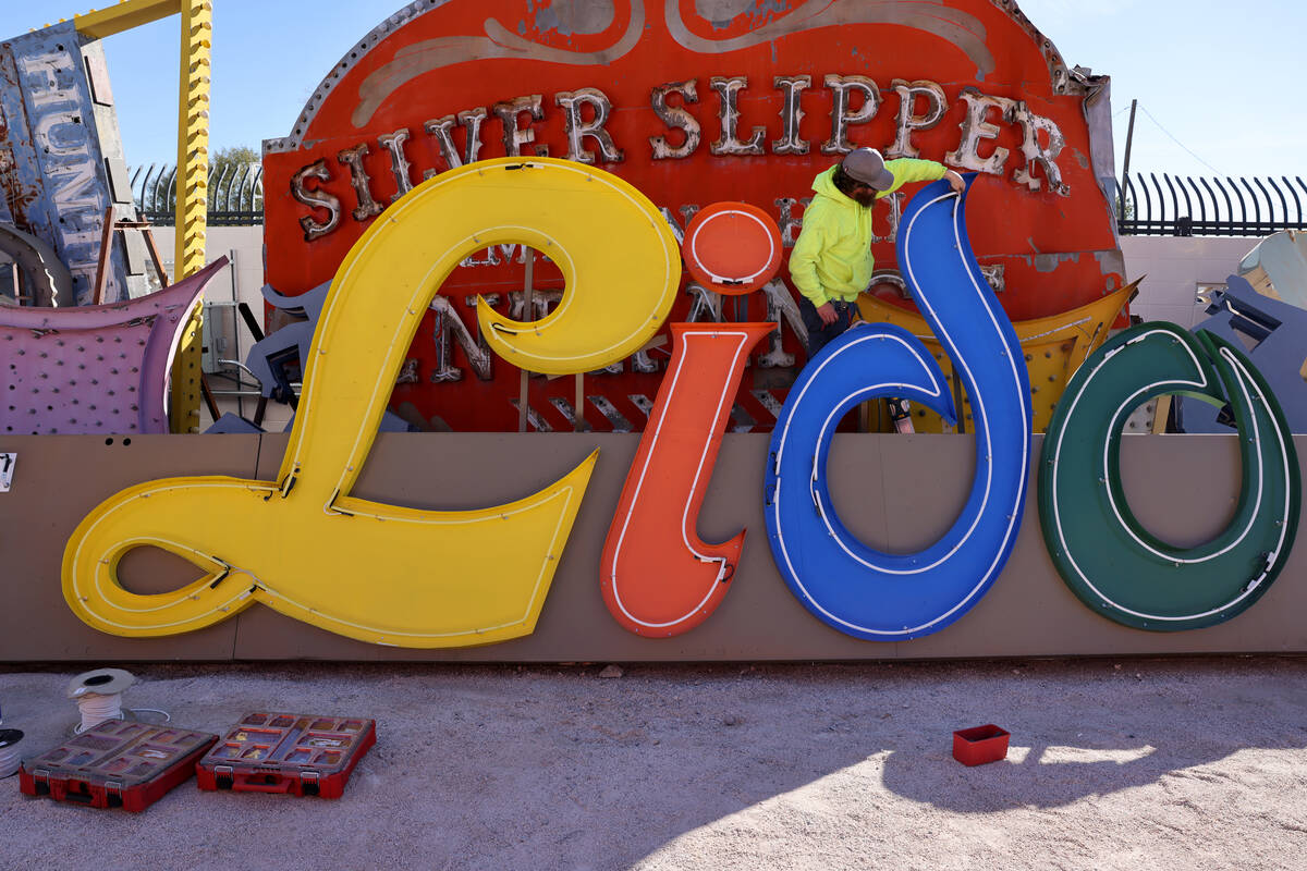 Zack Sawyer with Hartlauer Signs restore the Lido de Paris sign at the Neon Museum in downtown ...