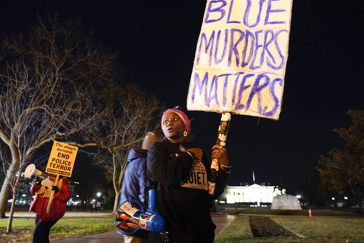 Nadine Seiler, of Waldorf, Md., demonstrates in Lafayette Park outside the White House in Washi ...