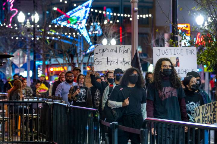 Participants march and chant along Fremont Street during a rally for Tyre Nichols organized by ...