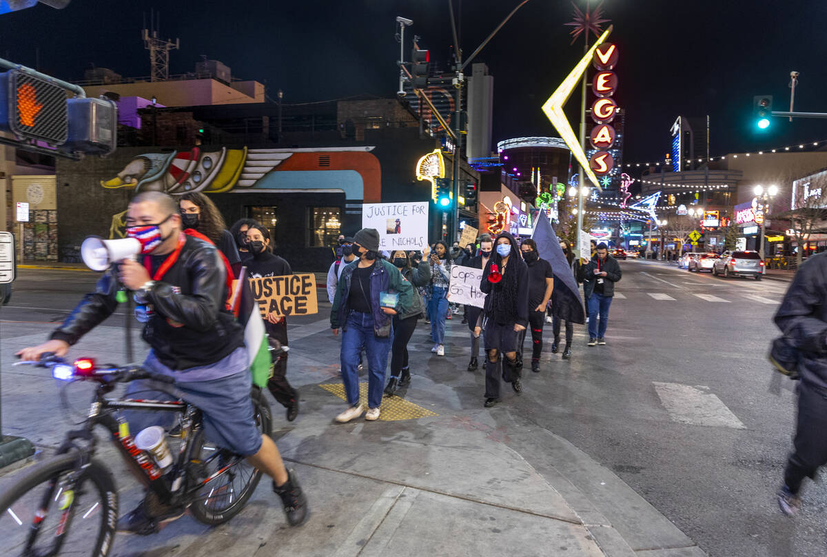 Participants march and chant along Fremont Street during a rally for Tyre Nichols organized by ...