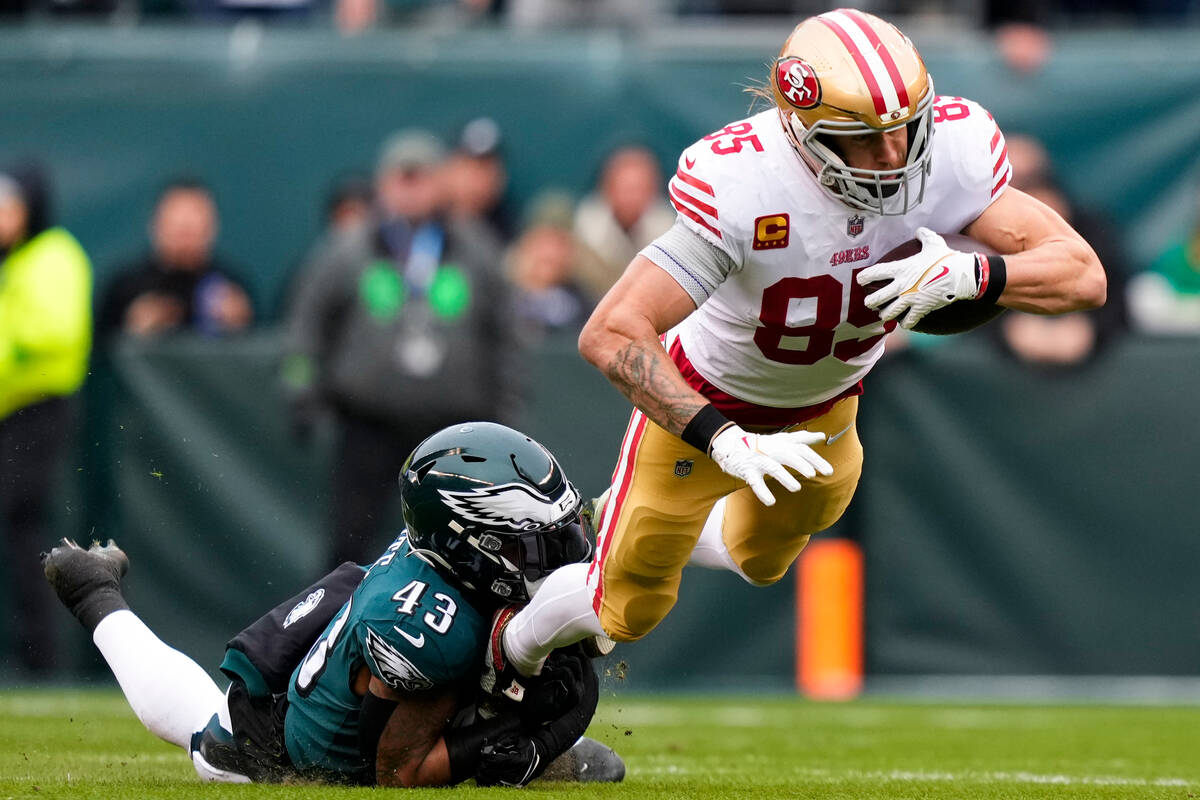 San Francisco 49ers tight end George Kittle (85) dives forward while being tackled by Philadelp ...