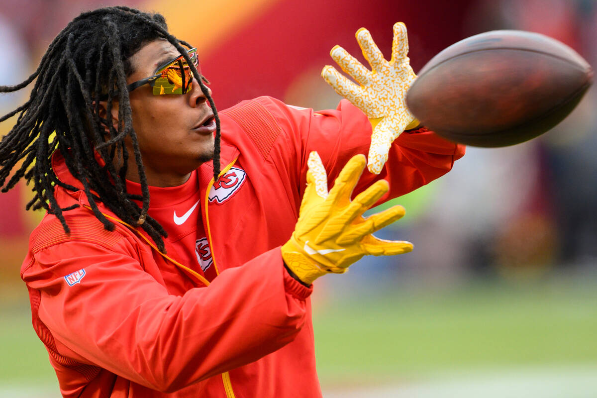 Kansas City Chiefs running back Isiah Pacheco makes a catch during warmups before the NFL AFC C ...