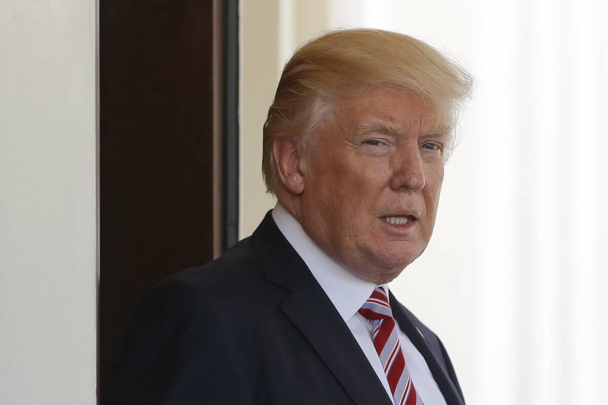 President Donald Trump watches Turkish President Recep Tayyip Erdogan depart the White House in ...