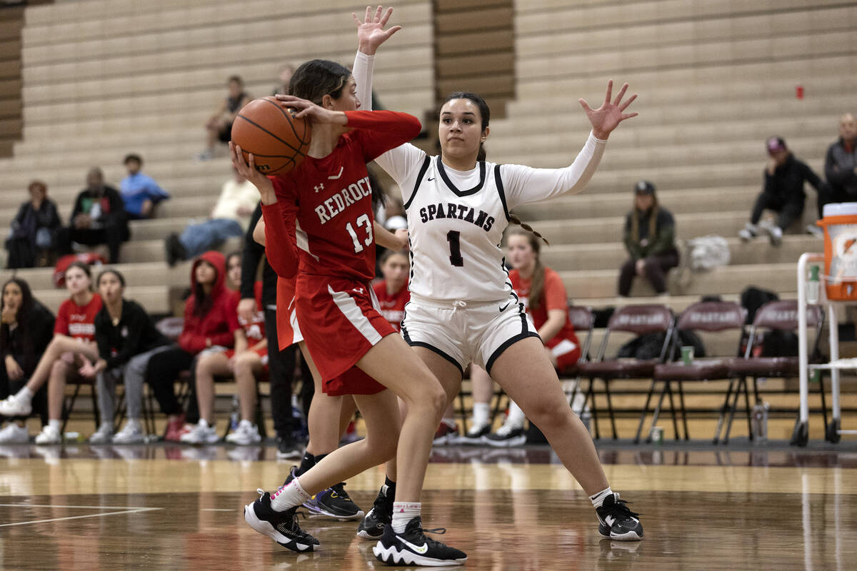 Doral’s Peyton Gomez (13) looks for a teammate to pass to while Cimarron-Memorial’ ...