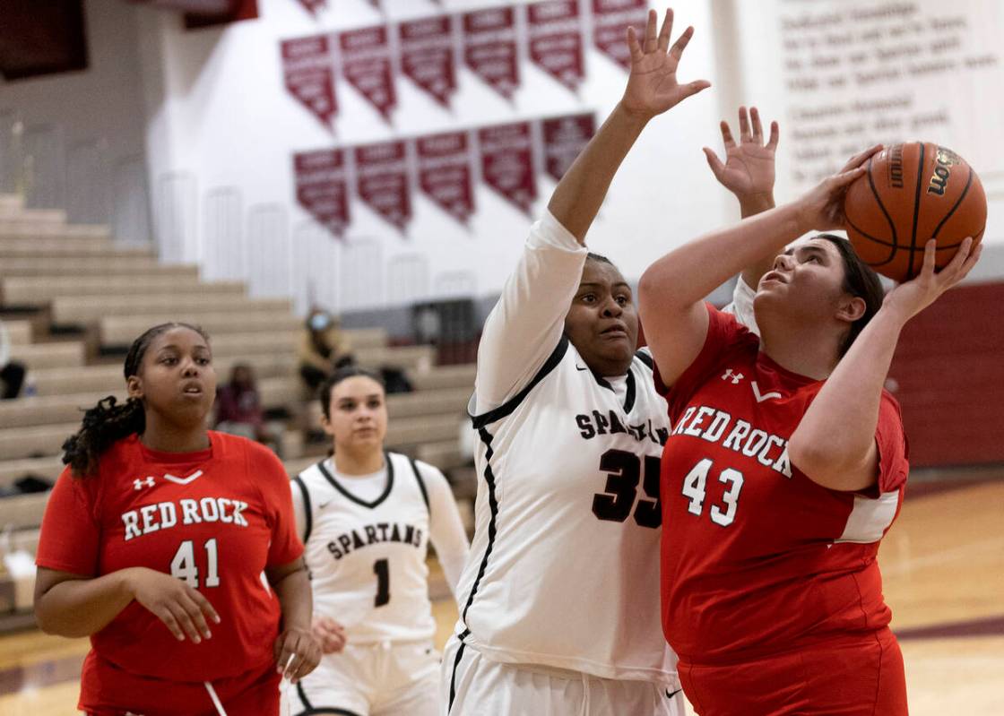 Doral’s Amanda Orasi (43) shoots against Cimarron-Memorial’s Aryah Harris (35) during a gir ...