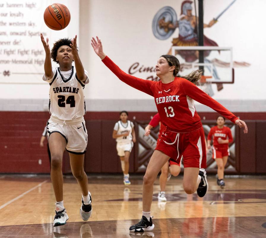 Cimarron-Memorial’s Maya Hobbs (24) runs to catch a pass while Doral’s Peyton Graham (13) r ...