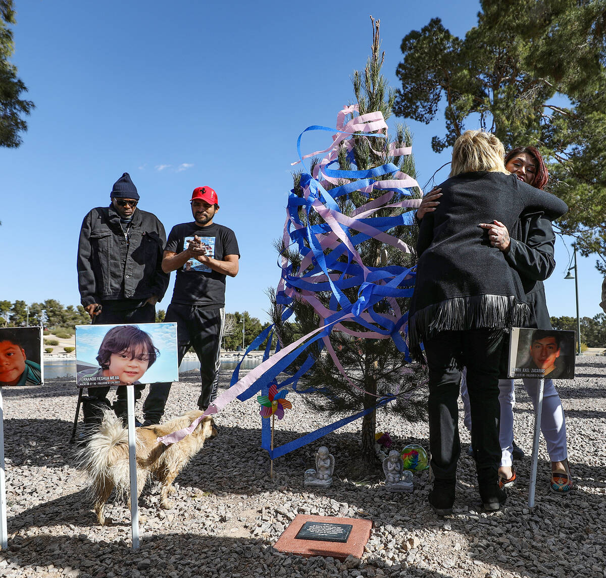 North Las Vegas Mayor Pamela Goynes-Brown hugs Erlinda Zacarias, who lost seven members of her ...